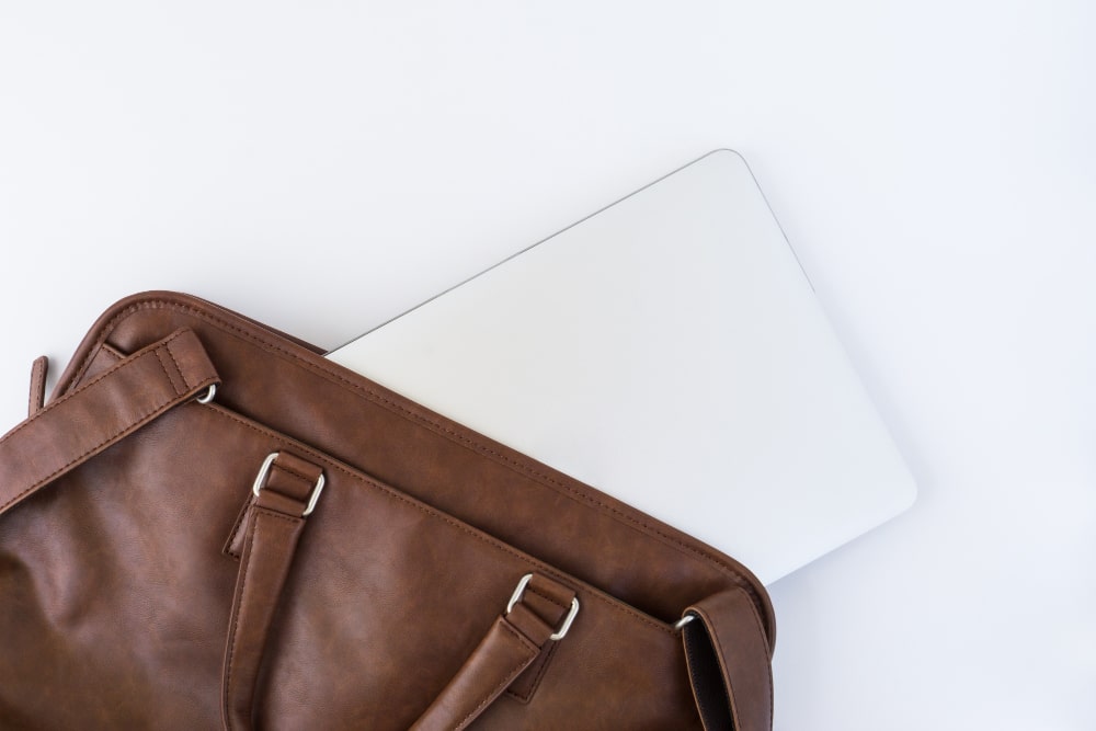 A stylish laptop case holds a laptop, showcasing a blend of fashion and functionality.